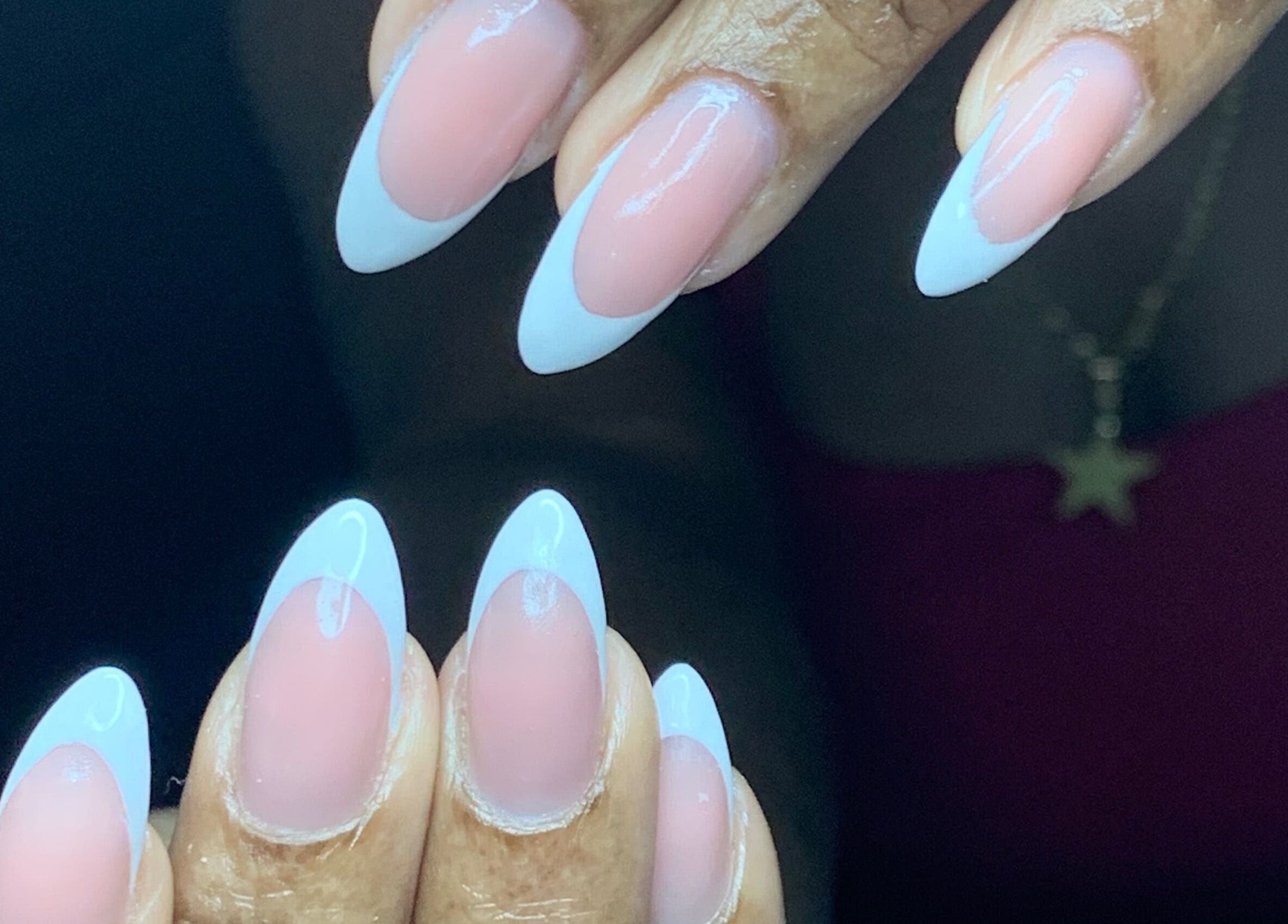 Chic French manicure at Venomcave, Paramaribo, Paramaribo, SR showcasing pink and white nail art.