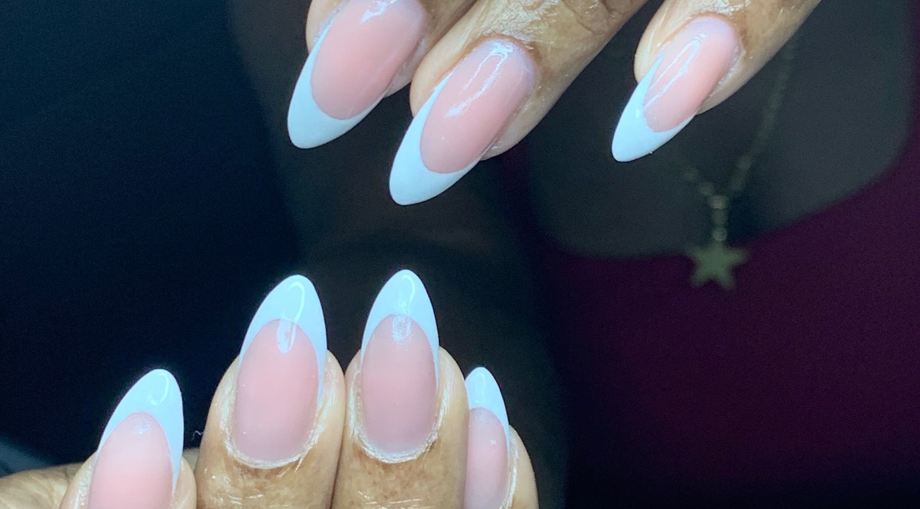 Chic French manicure at Venomcave, Paramaribo, Paramaribo, SR showcasing pink and white nail art.