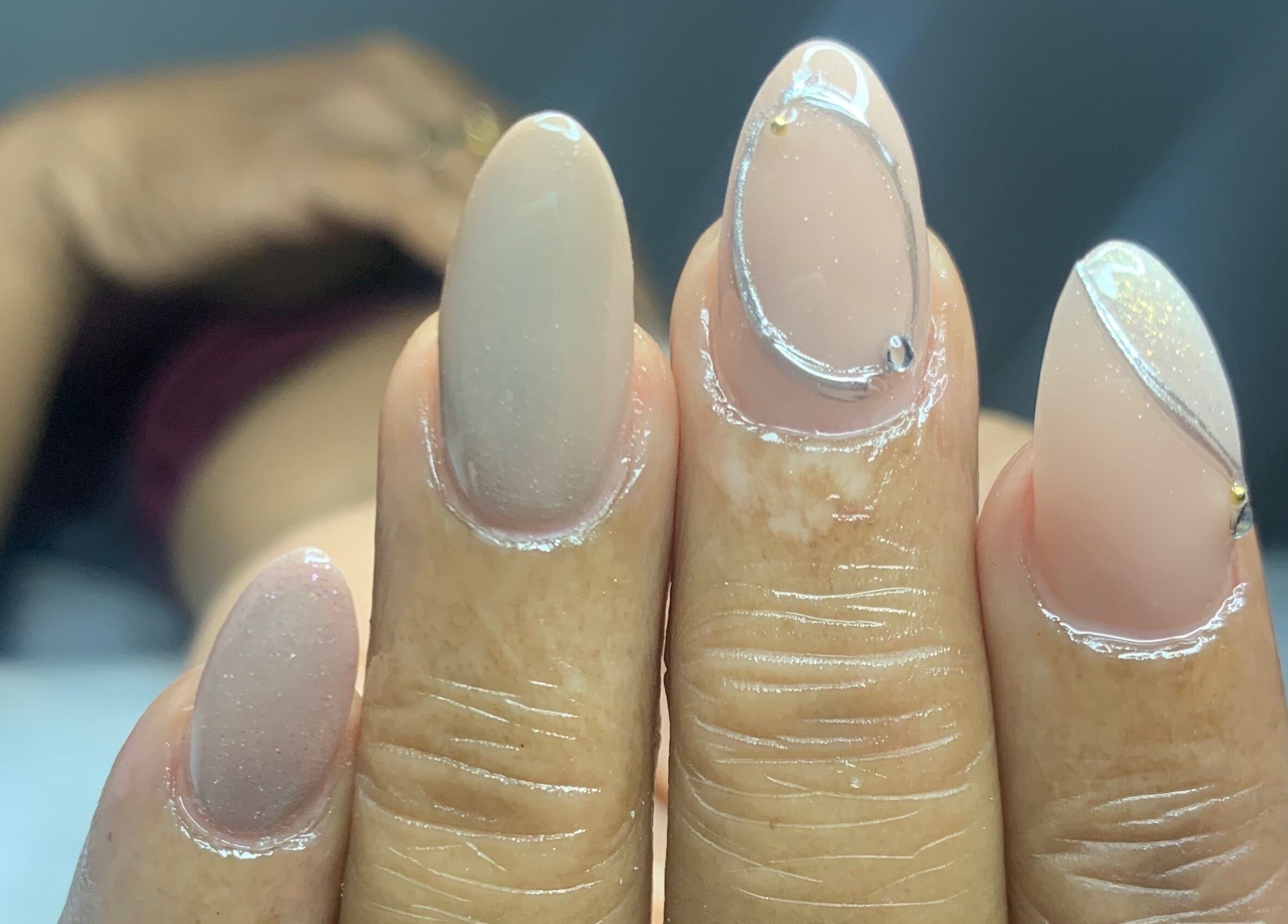 Close-up of elegant manicured nails at Venomcave, Paramaribo, Paramaribo, SR highlighting stylish nail art.