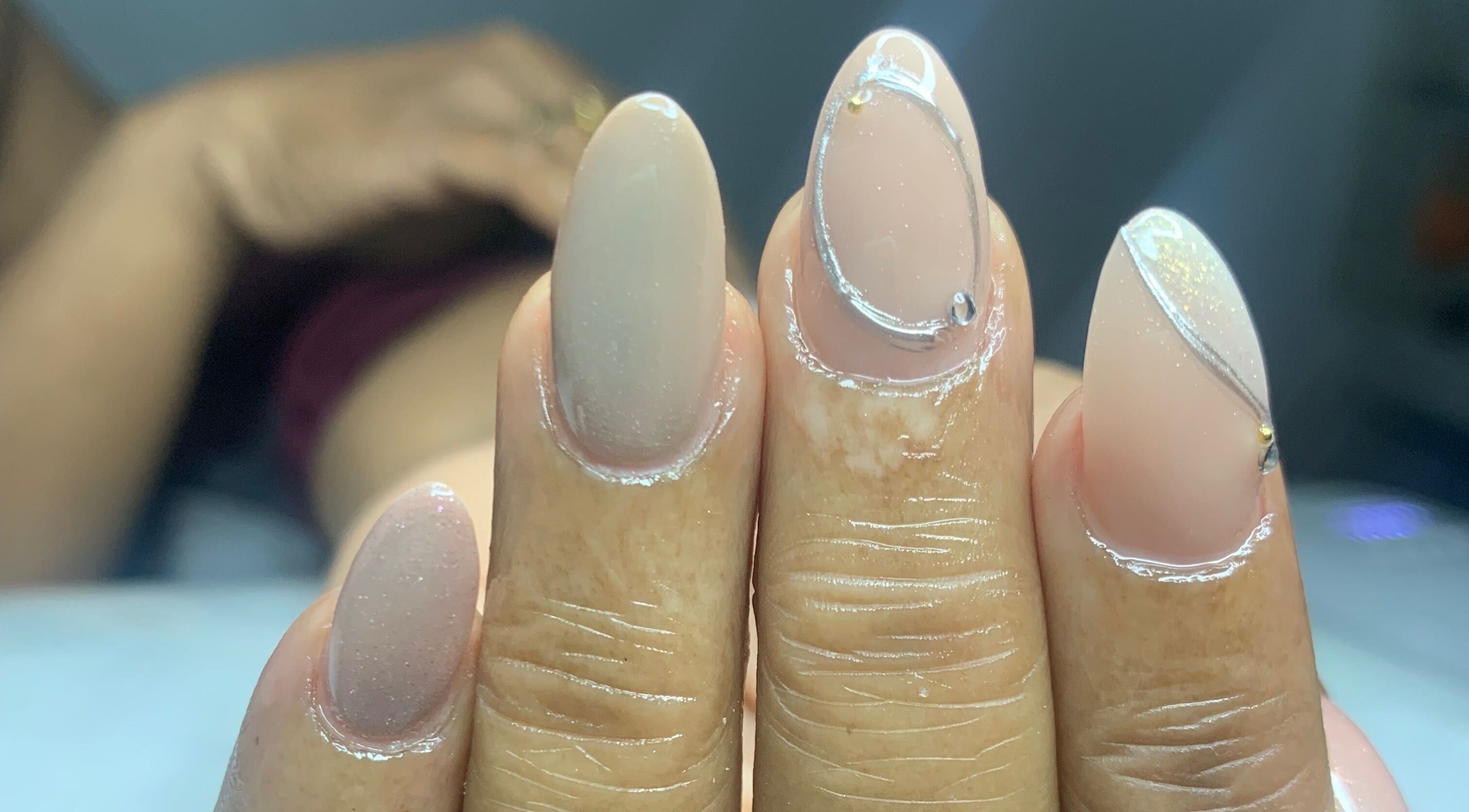 Close-up of elegant manicured nails at Venomcave, Paramaribo, Paramaribo, SR highlighting stylish nail art.