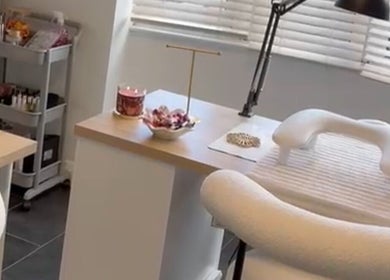 Nail care station at The Nail Studio.By Grace in Nantwich, England, GB with cozy seating and elegant decor.