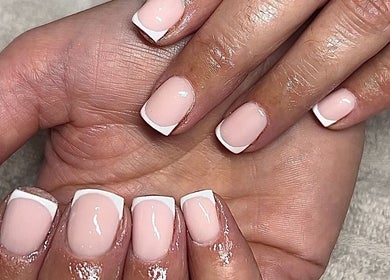 Elegant French manicure at The Nail Studio.By Grace, Nantwich, England, GB. Perfectly polished nails displayed.