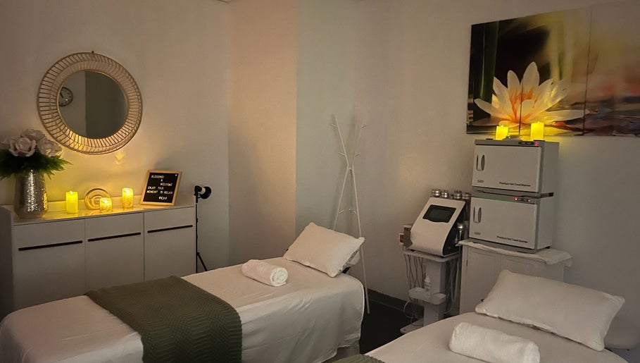 Relaxing treatment room at Self Care Spa - Wellness & Bodywork in Houston, Texas, US with cozy candles.