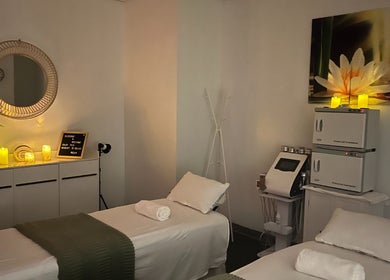 Relaxing treatment room at Self Care Spa - Wellness & Bodywork in Houston, Texas, US with cozy candles.
