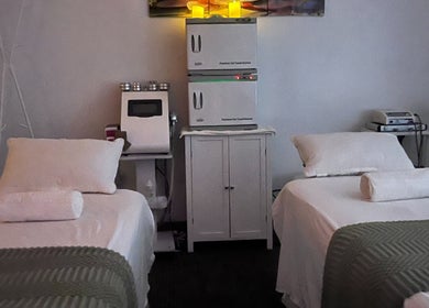 Relaxing massage room at Self Care Spa - Wellness & Bodywork in Houston, Texas, US, with treatment beds.