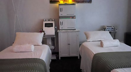 Relaxing massage room at Self Care Spa - Wellness & Bodywork in Houston, Texas, US, with treatment beds.