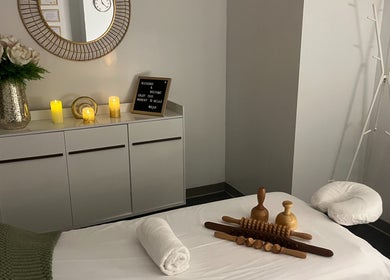 Relaxing massage room at Self Care Spa - Wellness & Bodywork in Houston, Texas, US with candles and decor.