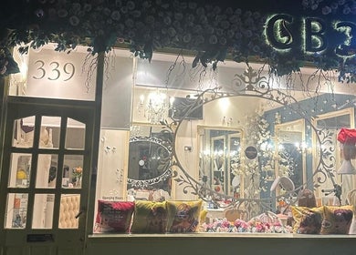 Front view of Floura Clinic in London, England, GB, showcasing an elegant and flower-adorned entrance.