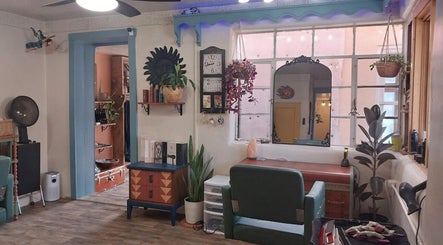 Cozy salon interior with vintage decor at Hair By Tina in Questa, New Mexico, US.