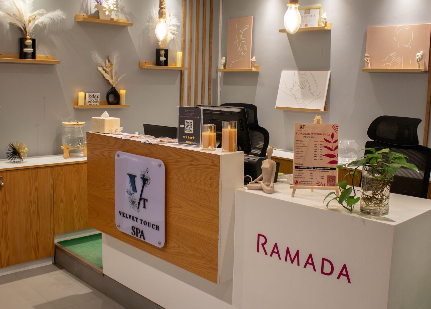 Reception area at Velvet Touch European Spa, Dubai, AE, featuring calming decor and elegant arrangement.