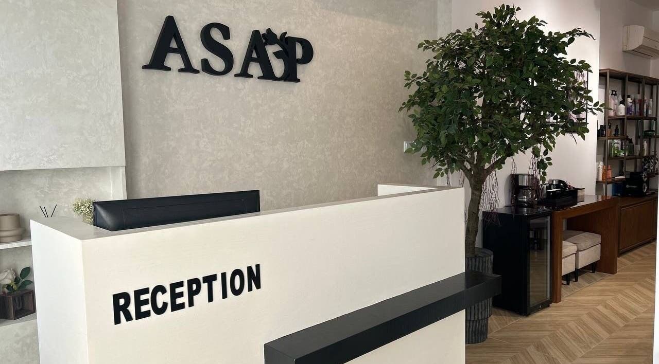 Reception area at Asap Salon in Dammam, Eastern Province, SA, featuring sleek decor and warm lighting.