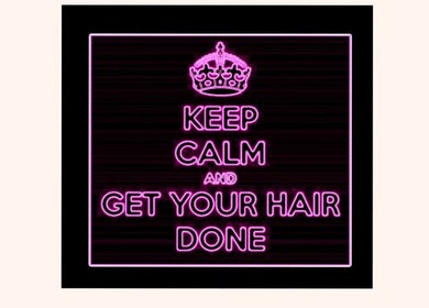 Pink neon sign at Shears in Duncanville, Texas, US encouraging visitors to relax and get their hair done.