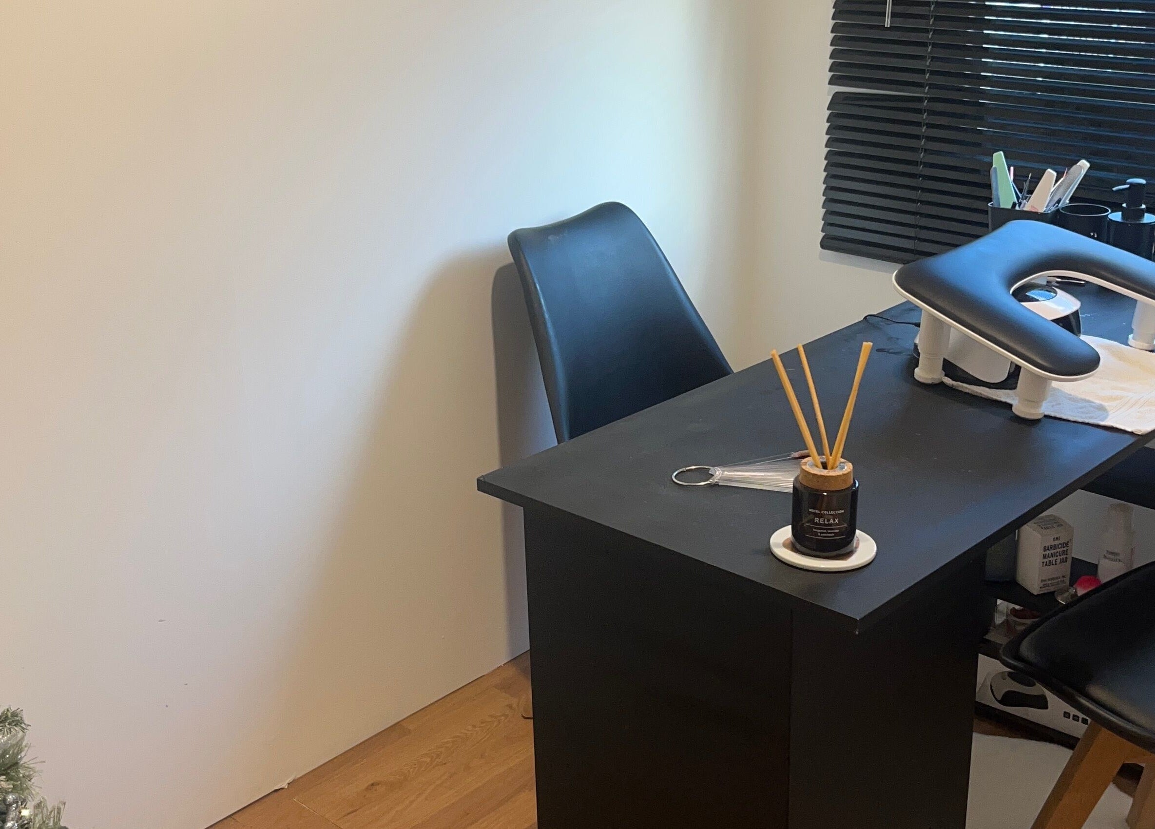Modern nail station at Nails by Lily, Horley, England, GB with chic decor and sleek black furniture.