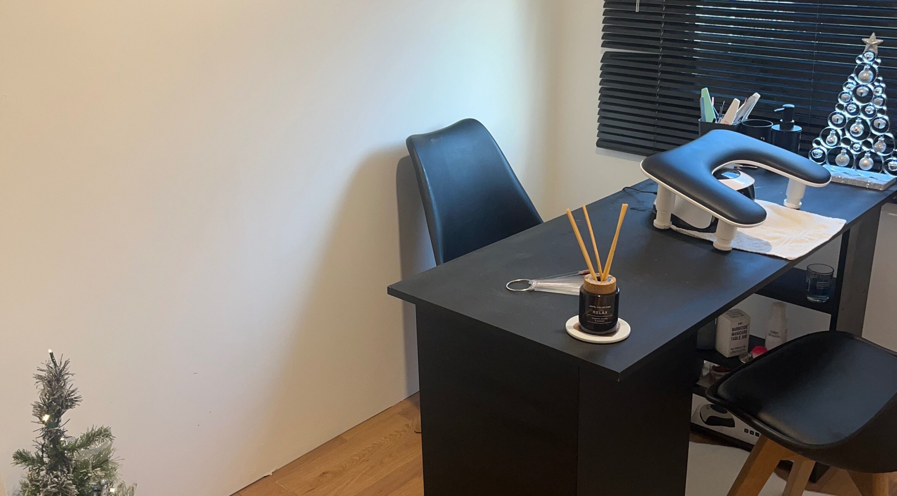 Modern nail station at Nails by Lily, Horley, England, GB with chic decor and sleek black furniture.