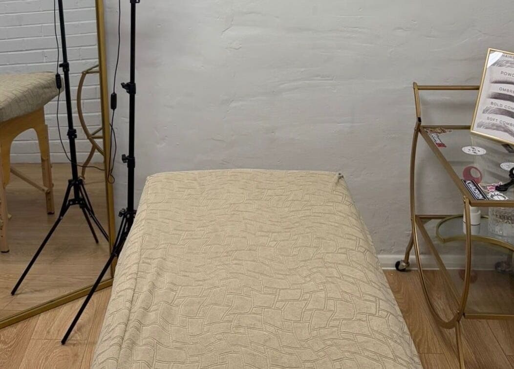 Calm treatment room at BEAUTY CULT, Wellingborough, England, GB, featuring a massage table and decor.