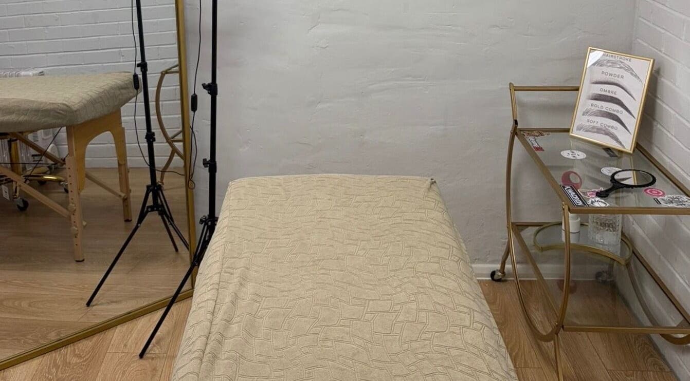 Calm treatment room at BEAUTY CULT, Wellingborough, England, GB, featuring a massage table and decor.