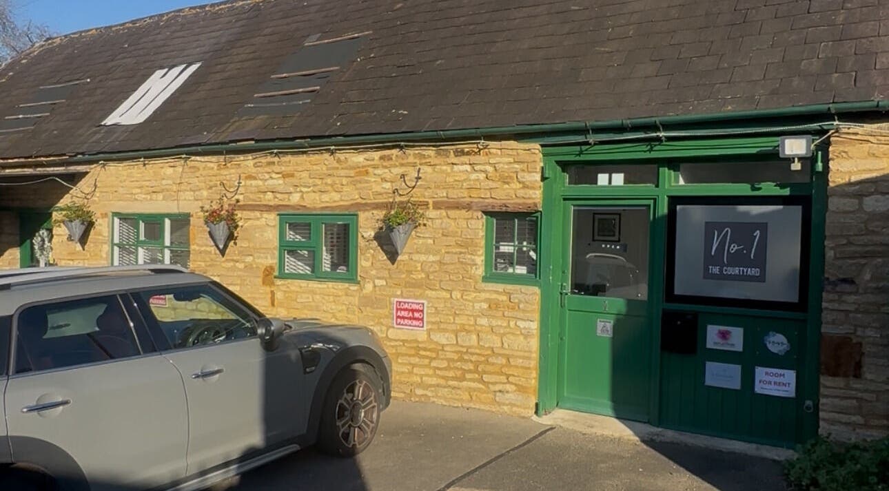 BEAUTY CULT venue exterior in Wellingborough, England, showcasing rustic stone and green accents.