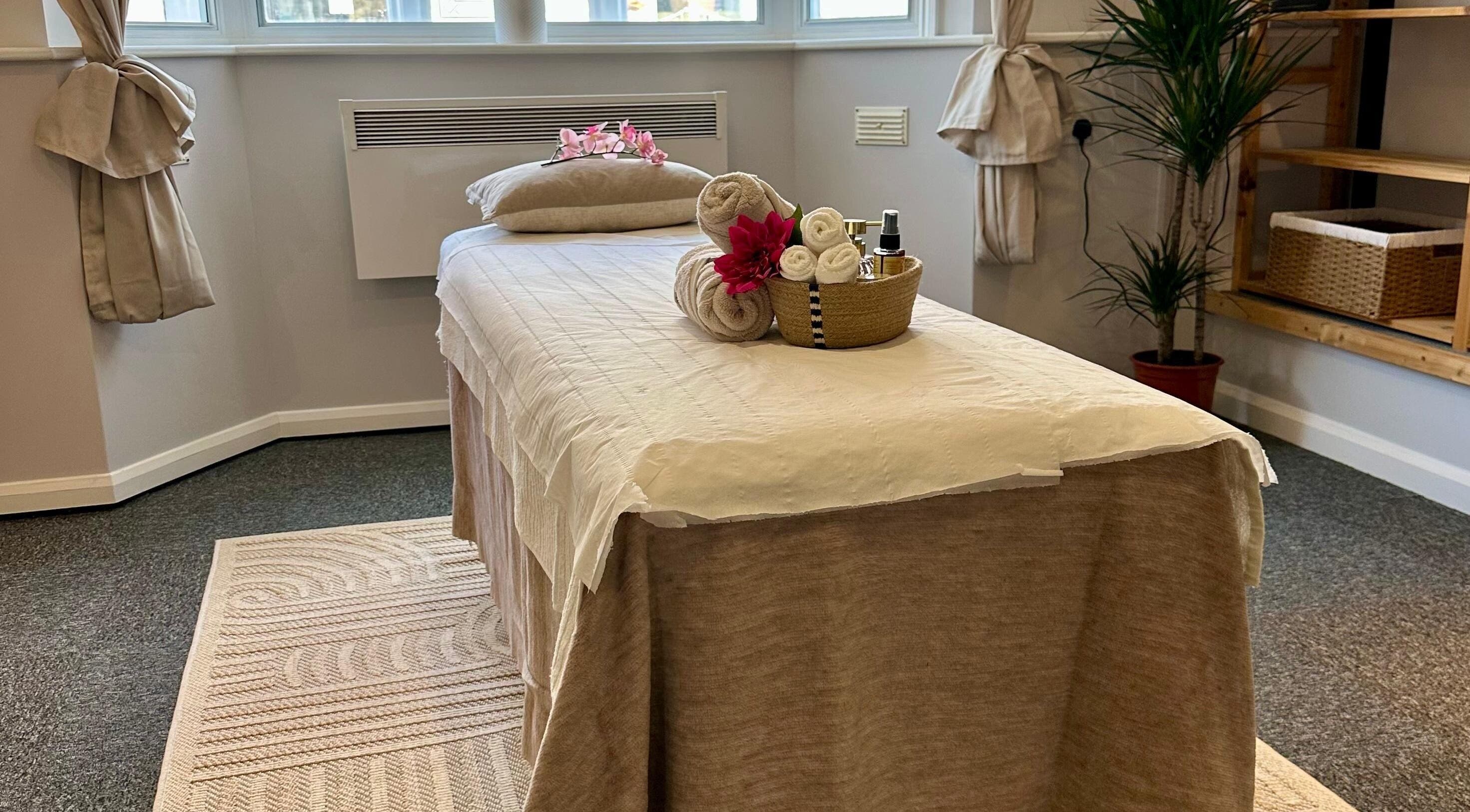 Serene massage room at UThai Massage in Sevenoaks, England, GB with relaxing decor and soft lighting.