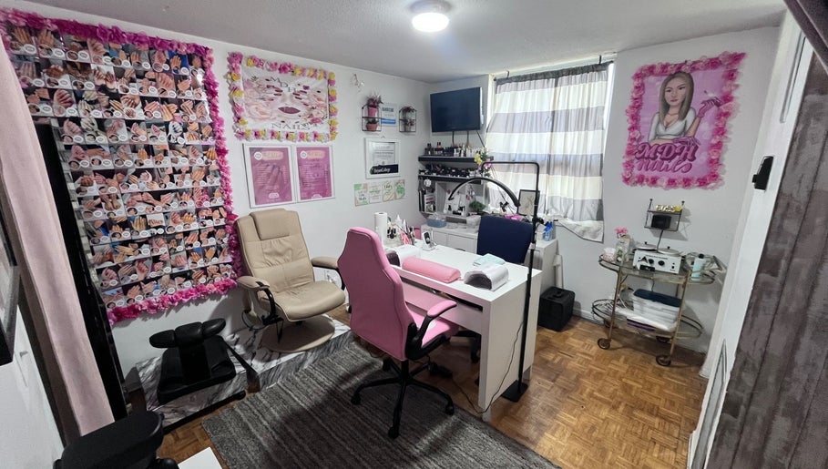 Cozy nail salon interior with pink accents at Mdh Nails in Toronto, Ontario, CA.