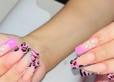 Vibrant pink and leopard print nail art at Mdh Nails in Toronto, Ontario, CA. A blend of floral and glamorous designs.