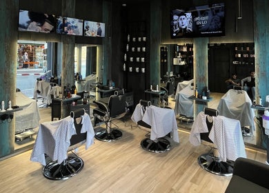 Interior of Mister Barber in Tétouan, Tanger-tétouan-al Hoceima, MA featuring sleek chairs and modern decor.