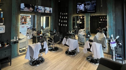 Interior of Mister Barber in Tétouan, Tanger-tétouan-al Hoceima, MA featuring sleek chairs and modern decor.