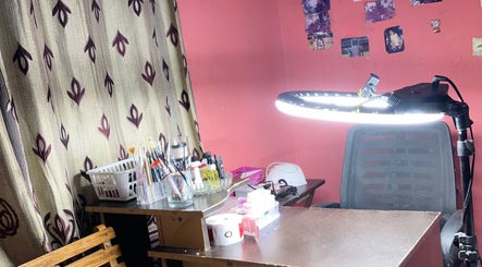 Nail art workstation at Nails by Jada, Princes Town Regional Corporation, TT with brushes and manicure tools.