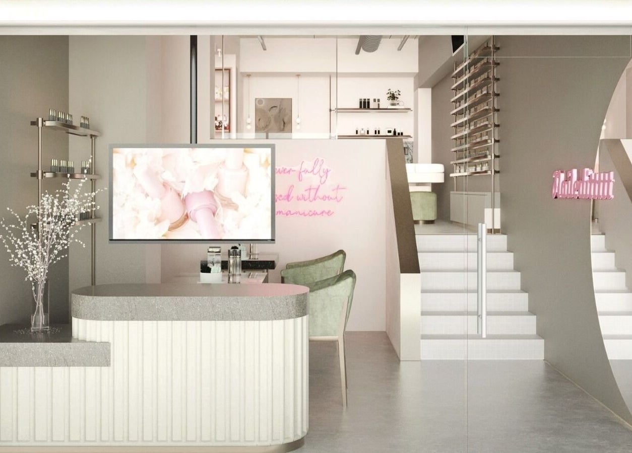 Interior of Nailedittttt - Far East Plaza in Singapore, featuring modern decor and cozy seating.