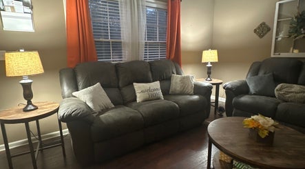 Comfortable seating area at Beam Me Up, New Johnsonville, Tennessee, with soft lighting and welcoming decor.