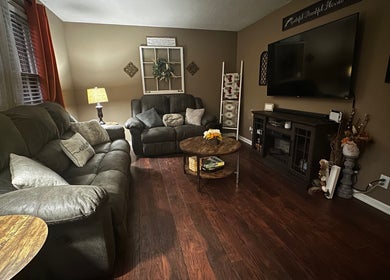 Inviting living room at Beam Me Up in New Johnsonville, Tennessee, US with plush sofas and ambient lighting.