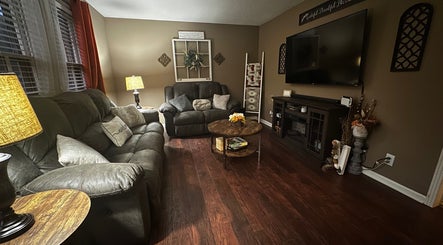 Inviting living room at Beam Me Up in New Johnsonville, Tennessee, US with plush sofas and ambient lighting.