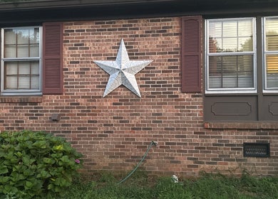 Brick facade with star decor at Beam Me Up, New Johnsonville, Tennessee, US.