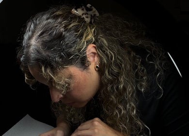 Lash artist at Endless Lash Beauty Lounge, Miramar, Florida, US, focused on precision work.