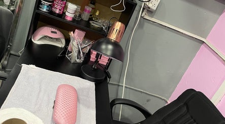 Chic nail station setup at Kute Klawz, Trincity, Tunapuna/Piarco Regional Corporation, TT. Ideal for gel applications.