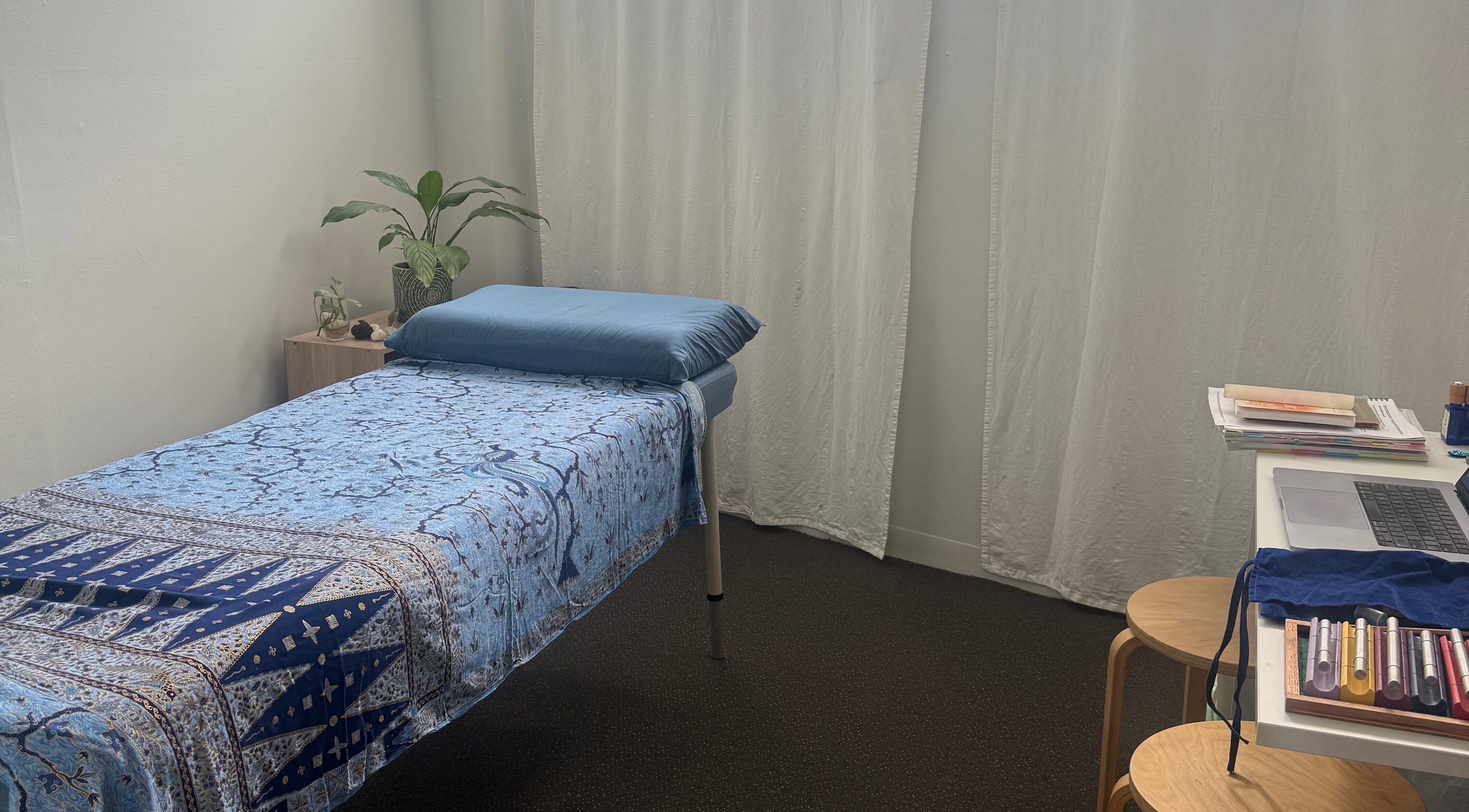 Calm therapy space at Soul Centred Kinesiology in Neutral Bay, New South Wales, AU with a blue massage bed.