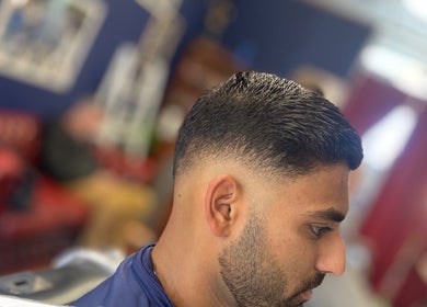 Stylish fade haircut at Indigo Barbers, Auckland, Auckland, NZ. Expert grooming in a chic atmosphere.