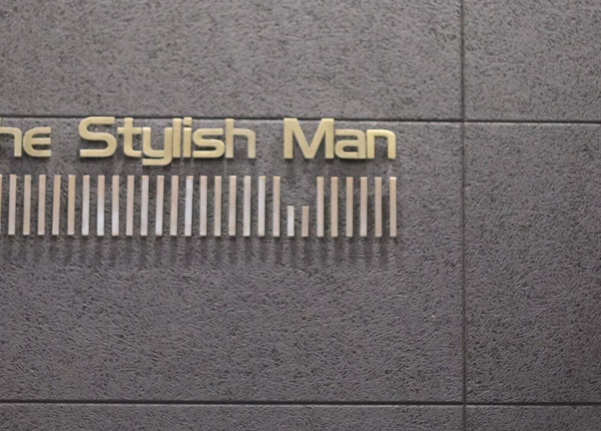 The Stylish Man sign on textured wall in Newmarket, Auckland, Auckland, NZ.