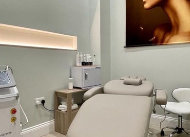 Sophisticated treatment room at Finesse Face™️ in Molesey, England, GB, featuring advanced skincare equipment.