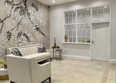 Elegant seating area with floral wall art at Finesse Face™️, Molesey, England, GB.