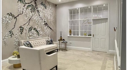Elegant seating area with floral wall art at Finesse Face™️, Molesey, England, GB.