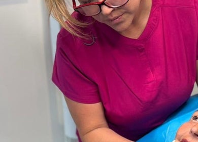 Beauty therapist at Finesse Face™️ providing facial treatment in Molesey, England, GB.