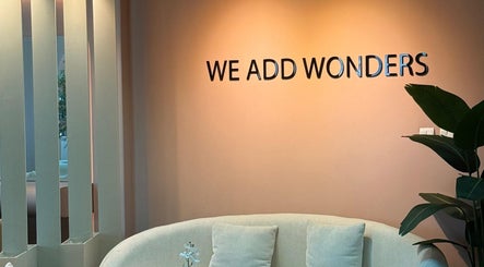 Elegant lounge area at WAW Beauty Lounge, Muscat, Muscat Governorate, OM, featuring a cozy sofa and soft lighting.