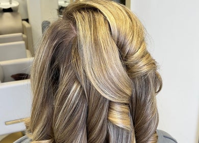 Stylish twisted hairstyle at The Blowdry Lounge by Alexandra, Upton Northampton, England, GB.