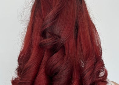 Vibrant red curls styled at The Blowdry Lounge by Alexandra, Upton Northampton, England, GB.
