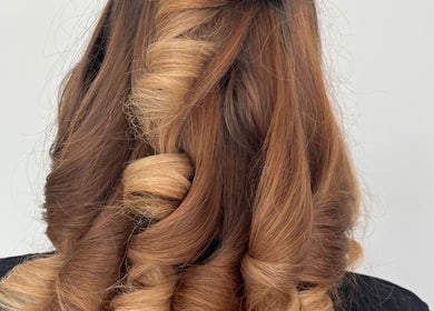 Elegant curls styled at The Blowdry Lounge by Alexandra in Upton Northampton, England, GB. Luxurious salon results.