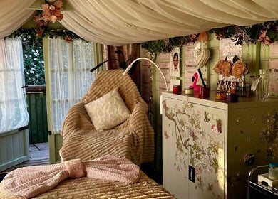 Cozy massage room at Serenity View Massage & Beauty, Ashbourne, England, GB, featuring plush decor.