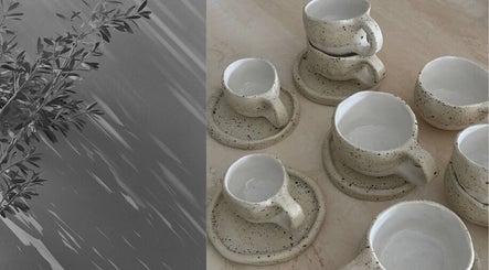 Artisan teacups with speckled finish on display at The Calii, Wollongong, New South Wales, AU.