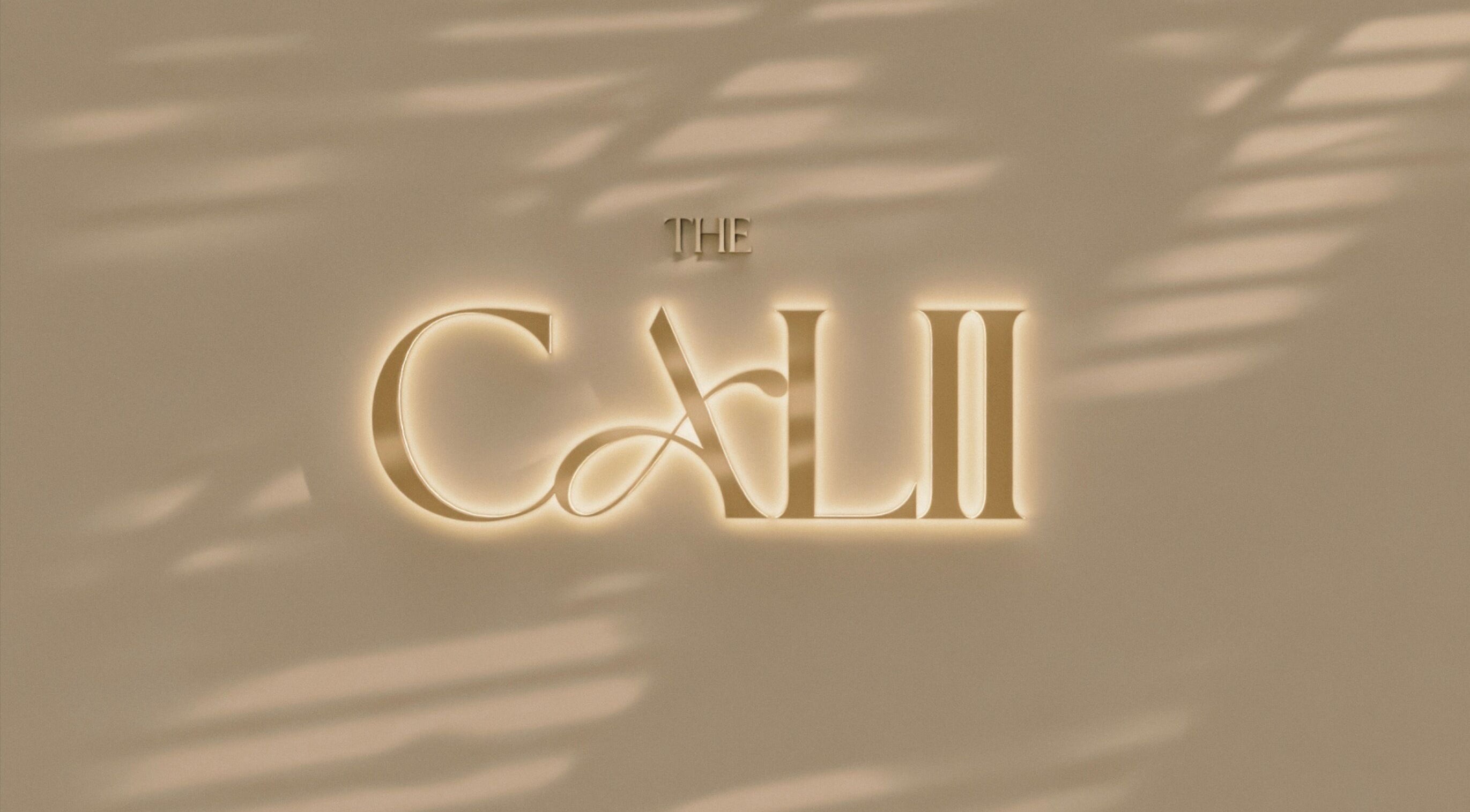 The Calii's elegant illuminated logo on a stylish wall in Wollongong, New South Wales, AU.
