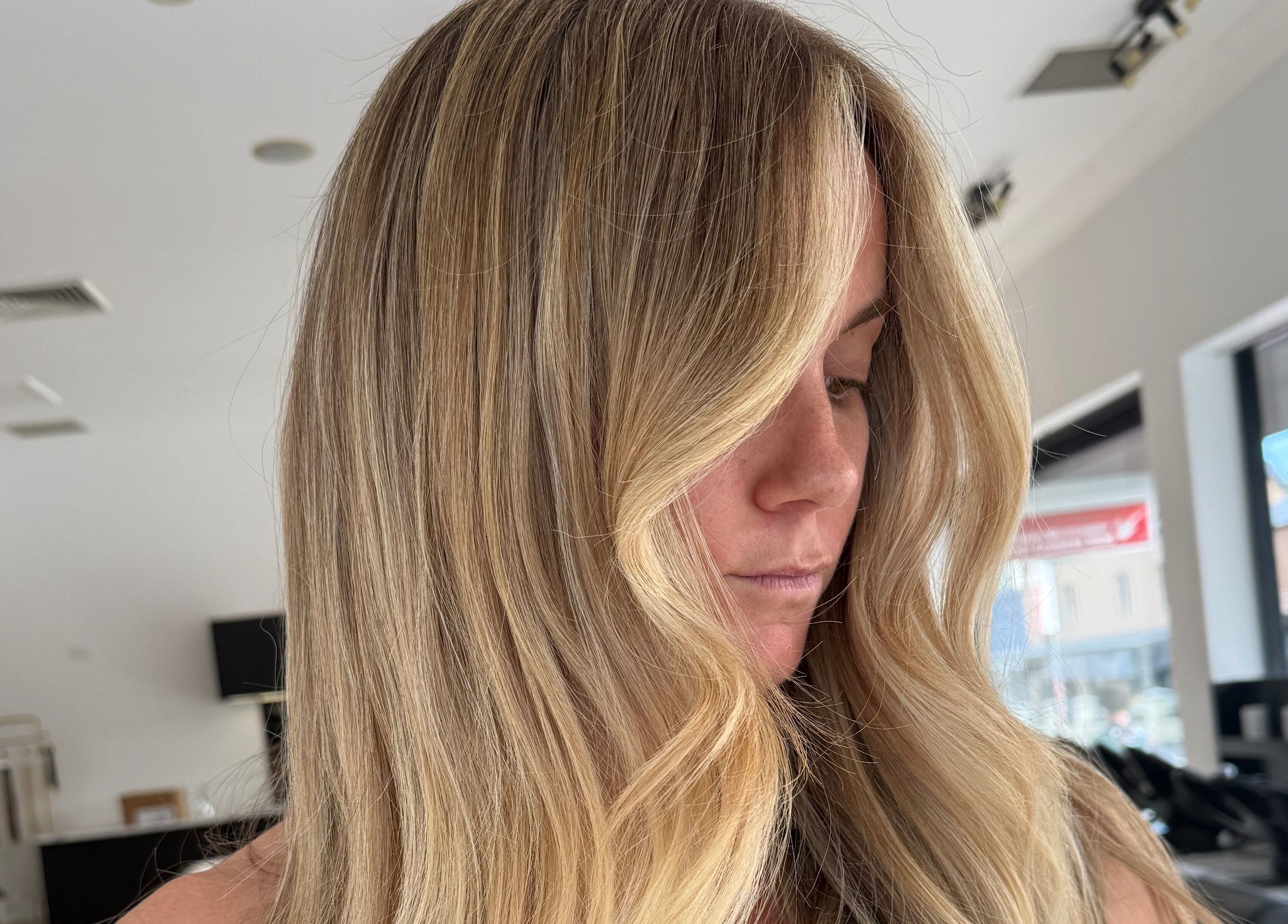 Elegant blonde woman with wavy hair at The Calii in Wollongong, New South Wales, AU.