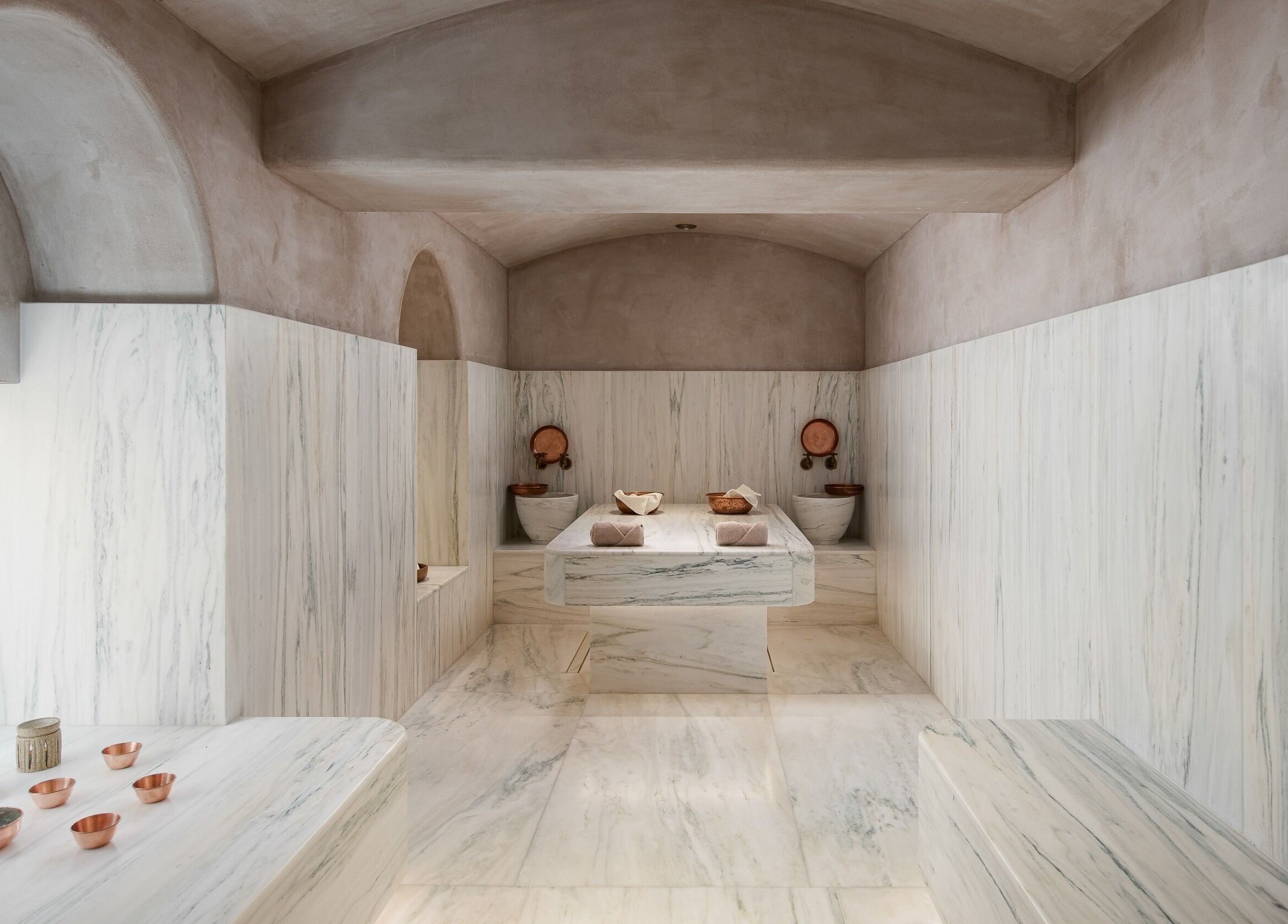 Luxurious marble spa interior at Niche Spa 300 B.C., Athina, GR, highlighting peaceful wellness ambience.